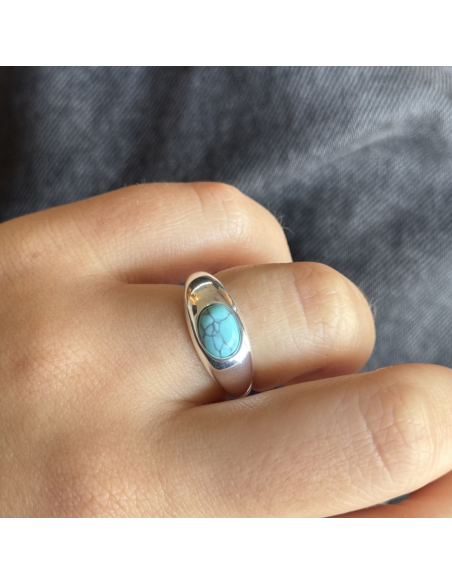 An.tipo cartier c/turquesa reconsitiuida oval  5 mm x 8 mm