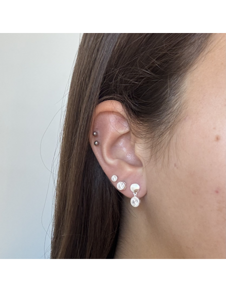 Torn. Colgante, circulo plata con piedra engarce ingles.
